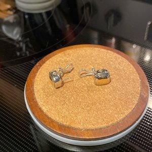 John Medeiros pierced earrings.